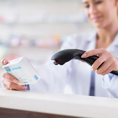 Handheld scanner capturing the data matrix code on a medication package